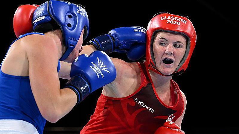 England boxer Sacha Hickey, right, fighting Australia's Eve Bryson in the women's 65kg category of the Commonwealth Games semi-finals 