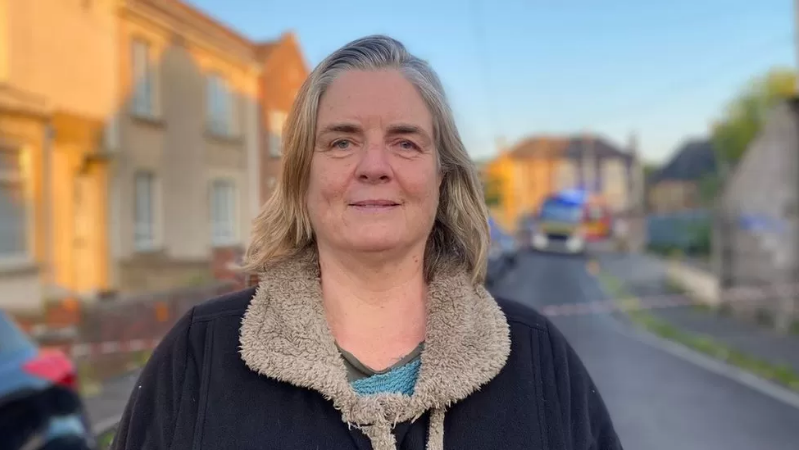 Laura Hamilton standing in the street by the road closure