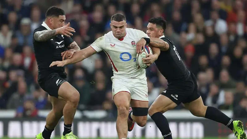 England back-row Ben Earl takes on New Zealand defenders during the Test match at Twickenham in November 2025 
