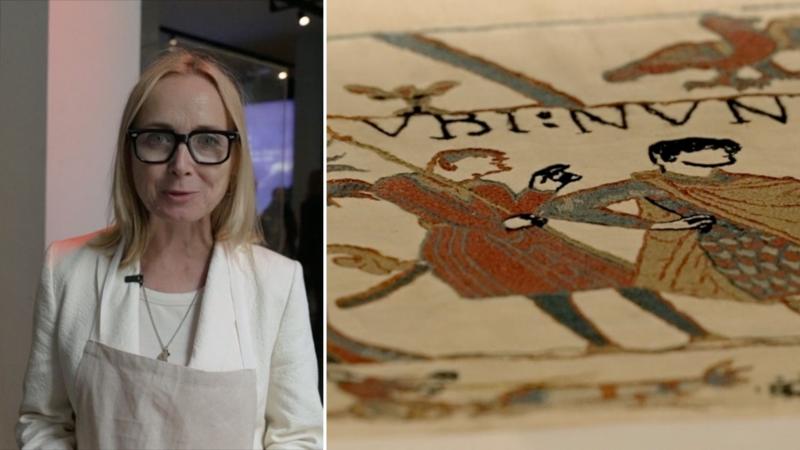 Donning protective kit for a first glance at the Bayeux Tapestry