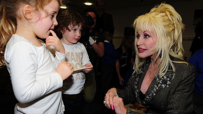 How Dolly Parton helped the world - from children's books to supporting Covid vaccine