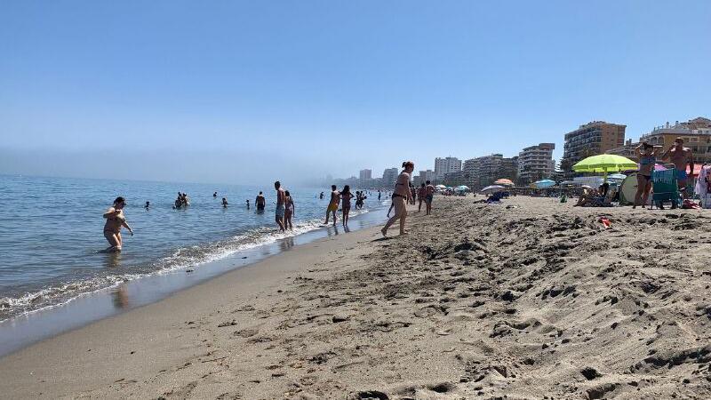 Bathers and sunbathers on the beach in Málaga