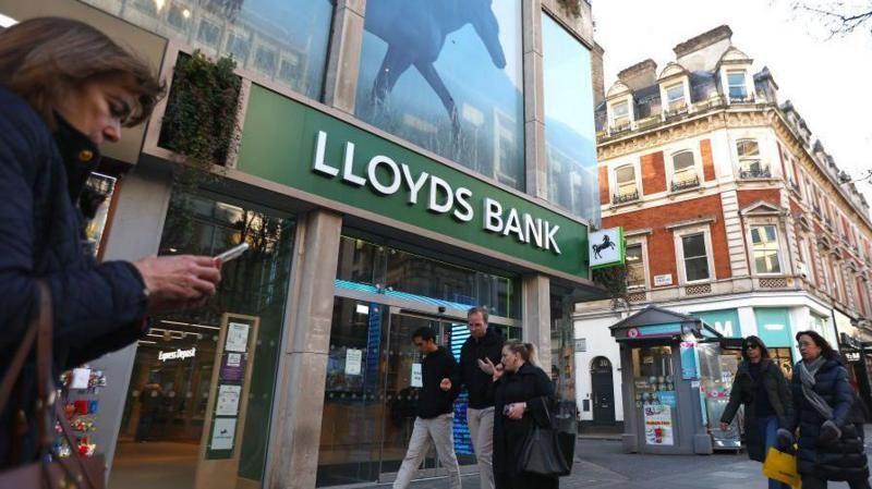 A Lloyds bank branch on a busy High Street