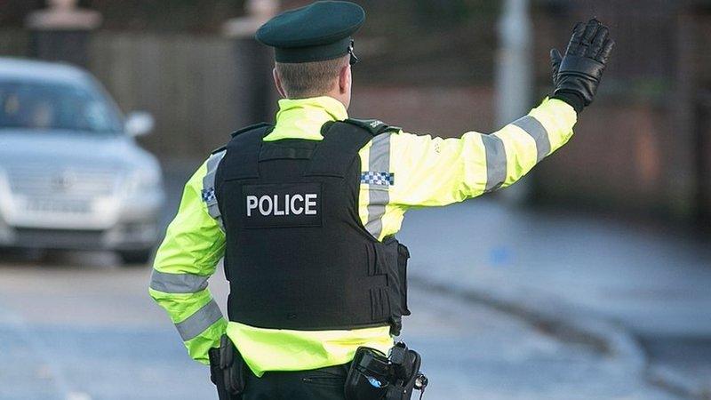 PSNI officer directing traffic