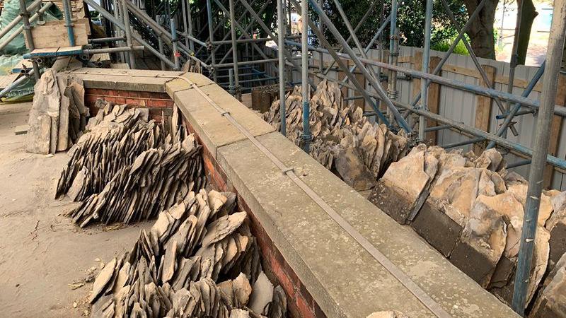 Piles of slate tiles on the edge of roof