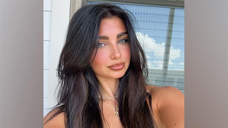 Savanna Stone has long dark hair in this selfie style photo.
