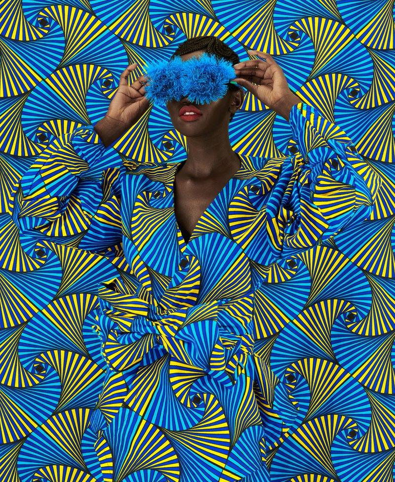 Woman disguised by swirling fabric