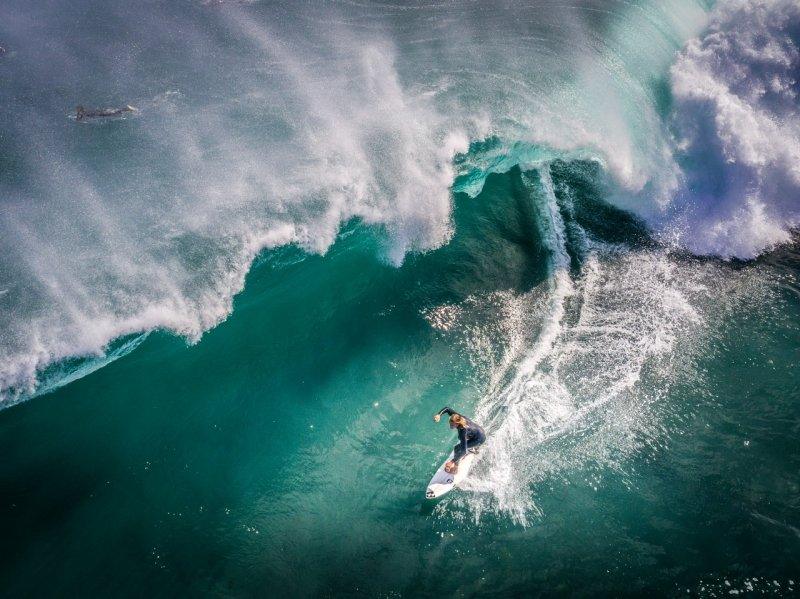 Margaret River, widely known for its award-winning wineries, is also home to some of the world's biggest and best surf breaks. In this photo by Shane Richardson, a surfer stands tall in the green room at North Point.