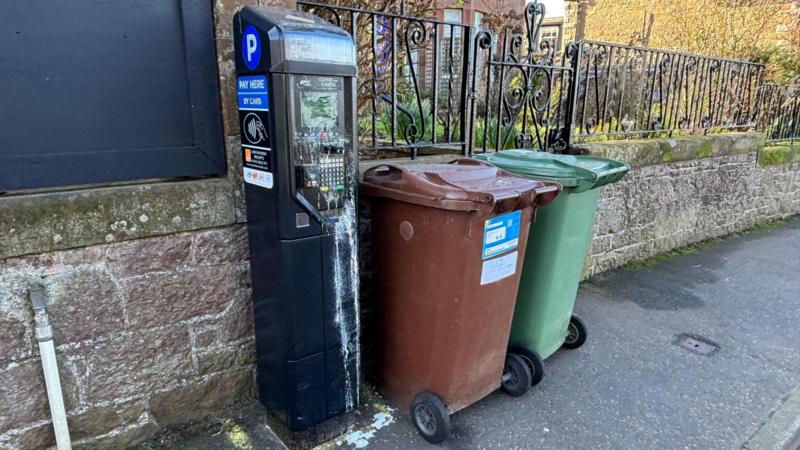 Battle over parking meters in sleepy seaside town sees machines glued shut