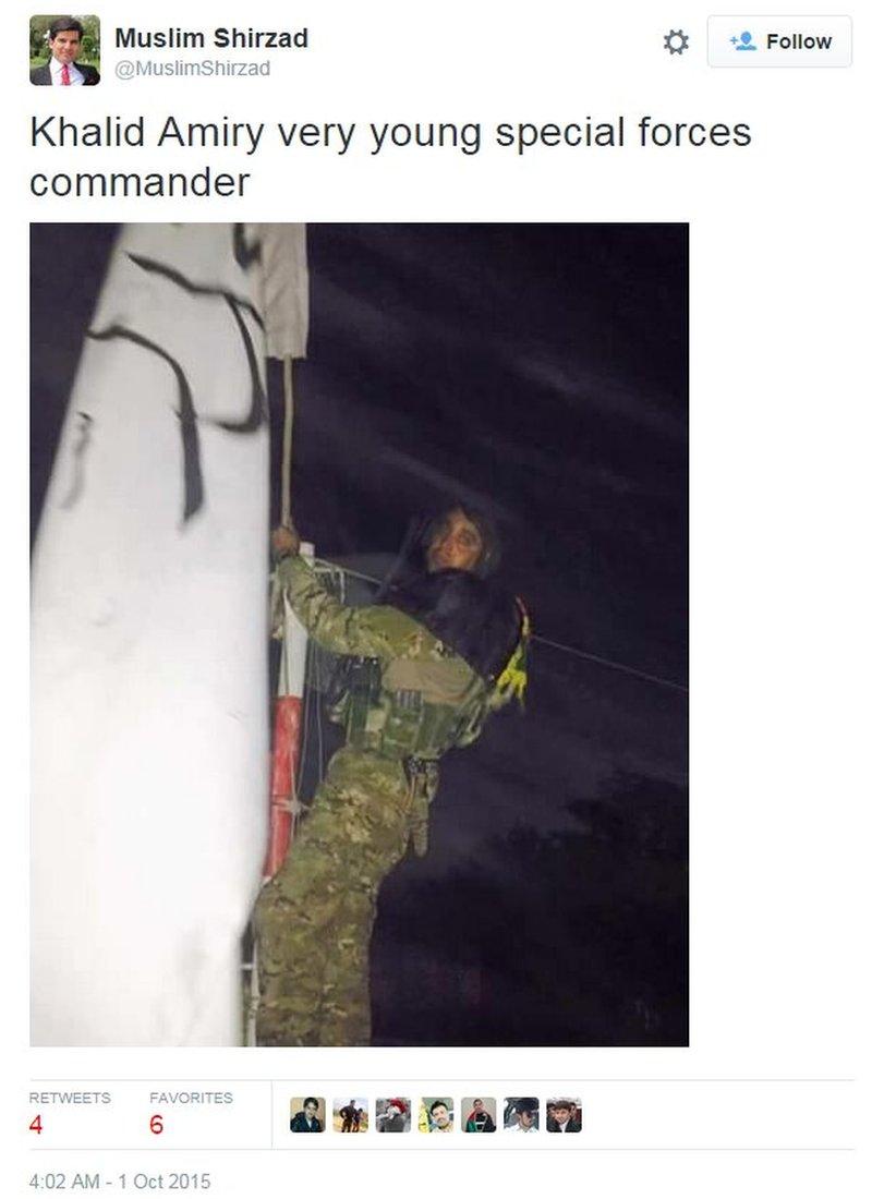 Afghan soldier climbing a flagpole to remove the Taliban flag