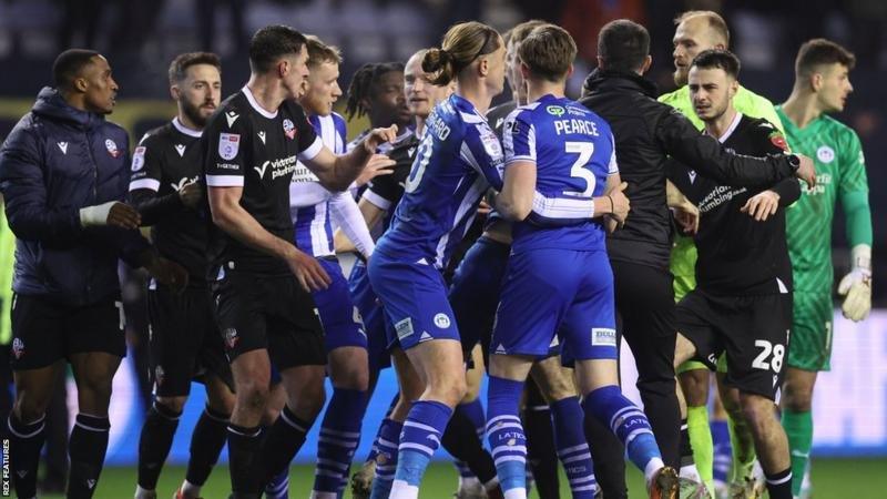 Wigan and Bolton players become embroiled at the full-time whistle