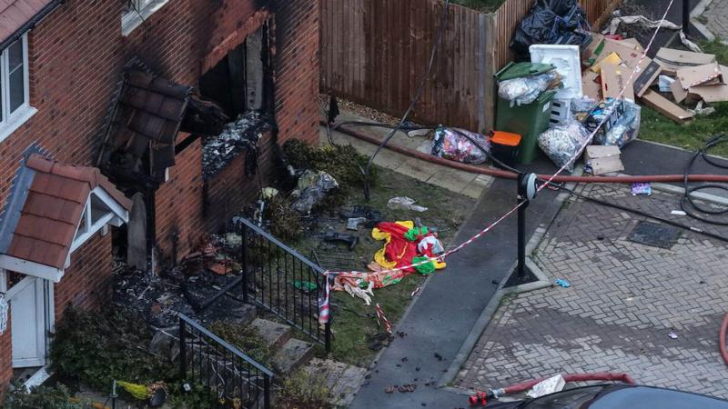Child dies and another in hospital after house fire
