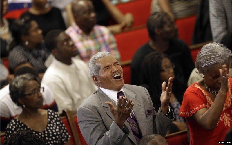 Parishioners sing during services at the Emanuel African Methodist Episcopal Church in Charleston, South Carolina, June 21, 2015.