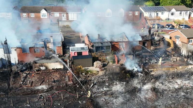 Streets evacuated after massive fire destroys homes