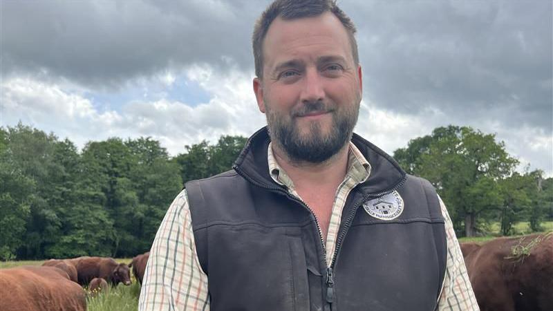 Close up shot of farmer James Windridge in a field in Surrey