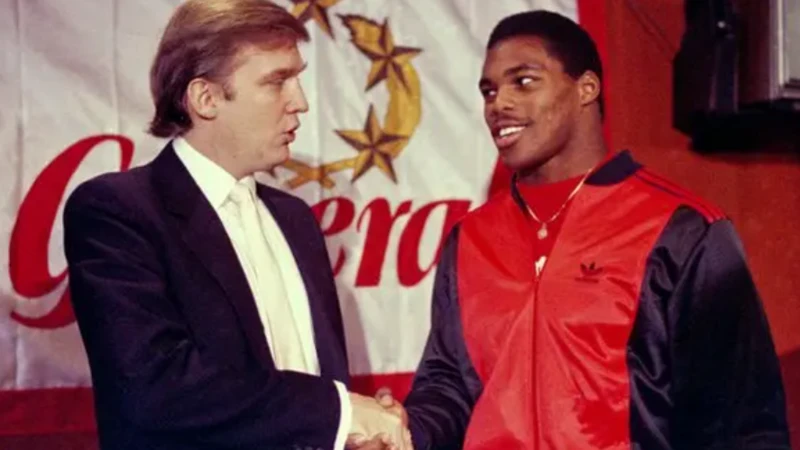 New Jersey Generals team owner Donald Trump shakes hands with running back Herschel Walker