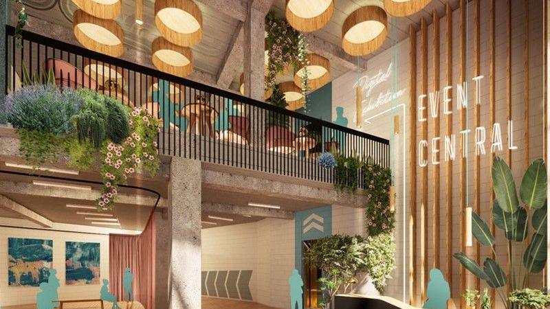 An artist's impression shows the inside of a modern building with a mezzanine floor and bare brick and wooden walls
