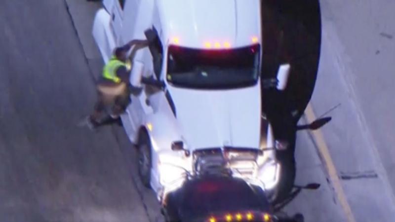 Moment suspects carjack a tanker lorry during police pursuit in LA