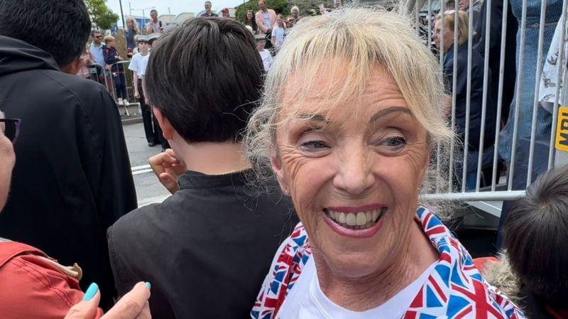 A woman in a Union Flag jacket