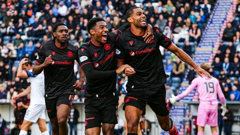 St Mirren's Mikael Mandron (R) celebrates scoring to make it 2-0 with teammate Jayden Richardson during a William Hill Premiership match between Falkirk and St Mirren at the Falkirk Stadium