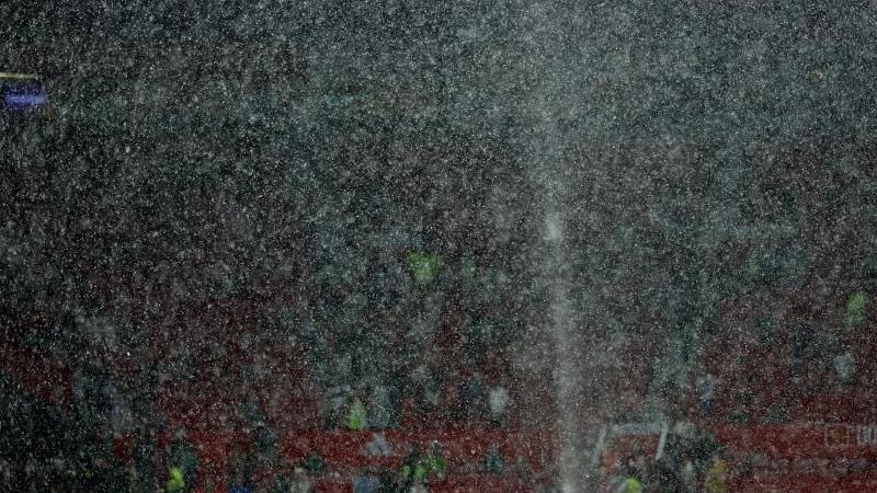 Rain shrouds seats in Old Trafford stand