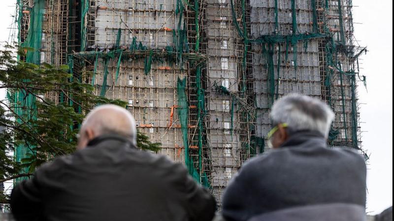 Hong Kong tower blocks fire death toll rises to 128