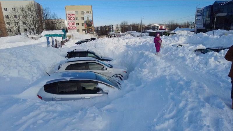Record snowfall leaves cars stuck and people stranded in Russia's Far East