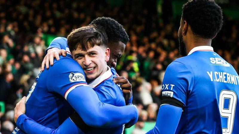 Mikey Moore hugs a Rangers team-mate in celebration