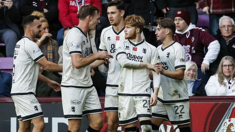 Dundee United's Luca Stephenson (2nd R) celebrates after scoring to make it 1-1 during a William Hill Premiership match between Heart of Midlothian and Dundee United at Tynecastle Park