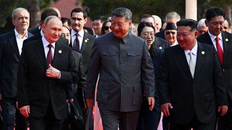 Moment Xi, Putin and Kim pose with world leaders at China's military parade