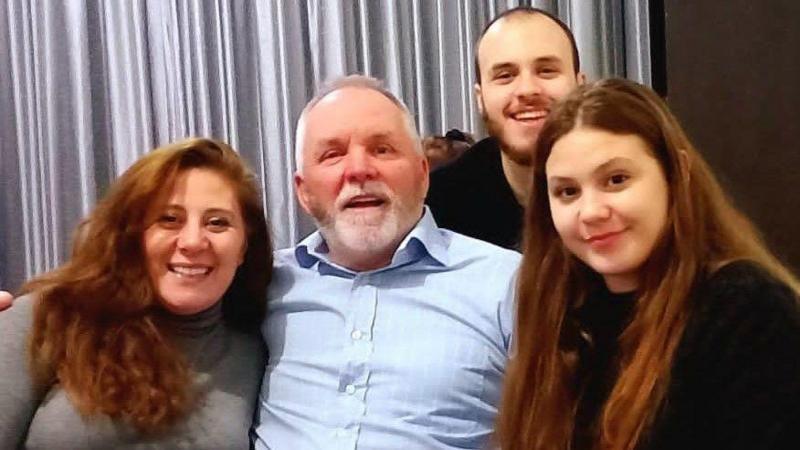 Nadia Ayoub McCulloch, William McCullough and their children Thomas and Rebecca - they are looking at the camera and smiling and laughing, 