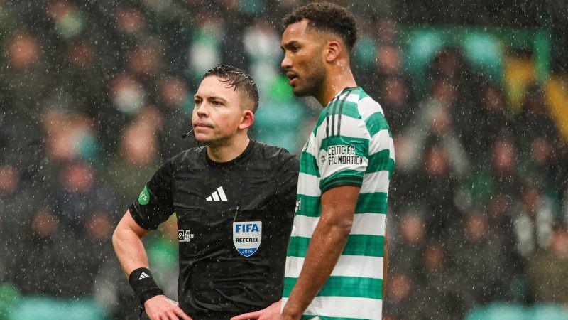 Celtic's Auston Trusty (R) and Referee Matthew MacDermid before Trusty is sent off following an altercation with Hibernian's Jamie McGrath during a William Hill Premiership match between Celtic and Hibernian at Celtic Park,