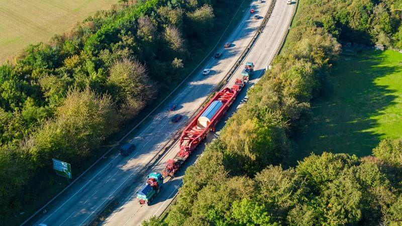 Large piece of power equipment being transported 