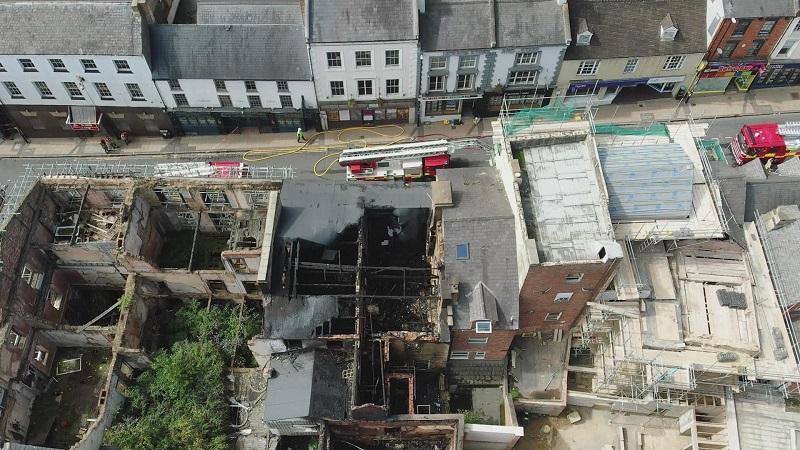 Aerial view of Bridge Street showing roofless fire-damaged building