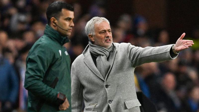 Fenerbahce's Jose Mourinho (right) complains to the fourth official