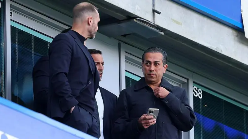 Chelsea co-owner Behdad Eghbali flanked by sporting directors Paul Winstanley and Laurence Stewart