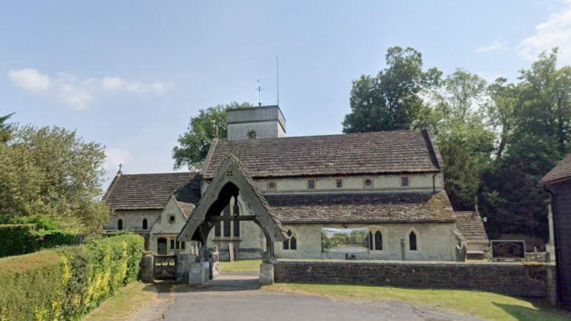 A Google Maps image of Betchworth Church building and archway as seen from the carpark