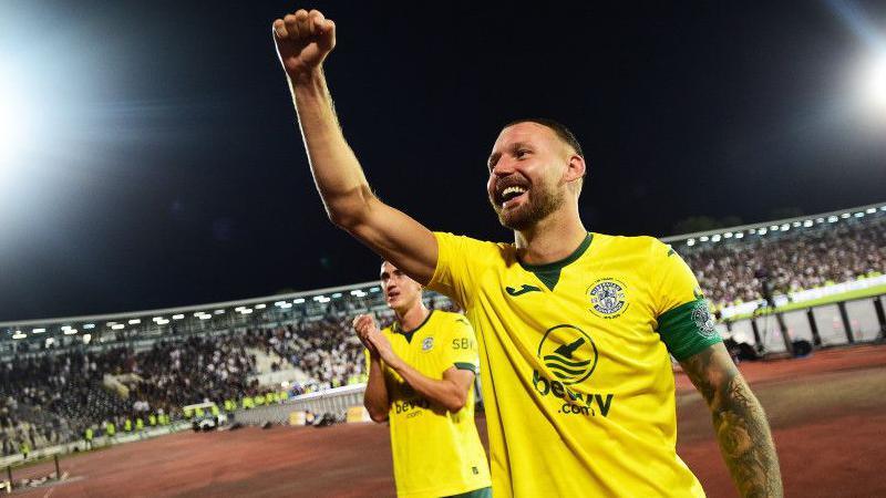 Hibs' Martin Boyle raises a fist in celebration after victory in Belgrade