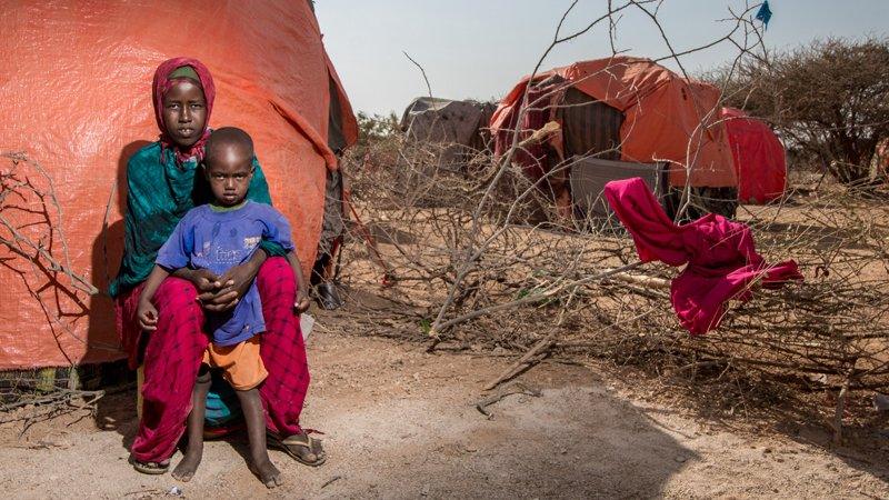 Fadumo, a mother of three children, with her one year old son Kulmiye