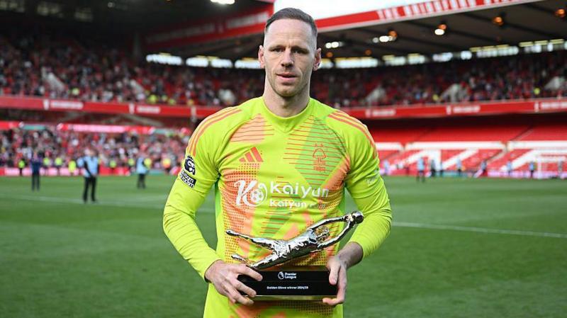 Matz Sels posing at the City Ground with the Golden Glove trophy