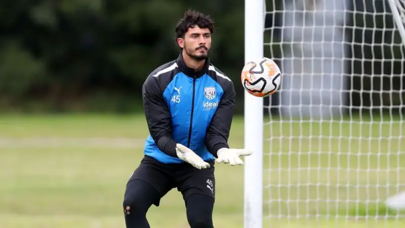 Wrexham goalkeeper Brad Foster signs a deal which will keep him at the club until the end of the season