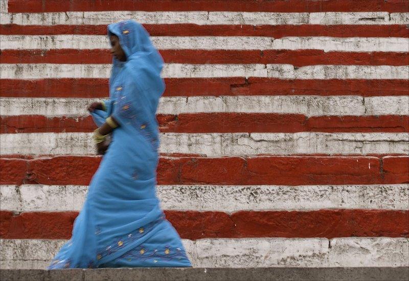 Woman in front of red and white steps
