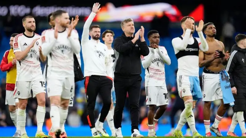 Salford City's players applaud their fans after a 2-0 defeat to Manchester City in the FA Cup