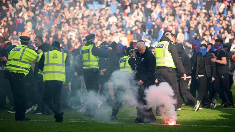 Police separate Celtic and Rangers fans after Ibrox pitch invasion