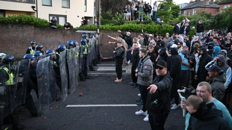 Police pelted with missiles at Henry Nowak protest