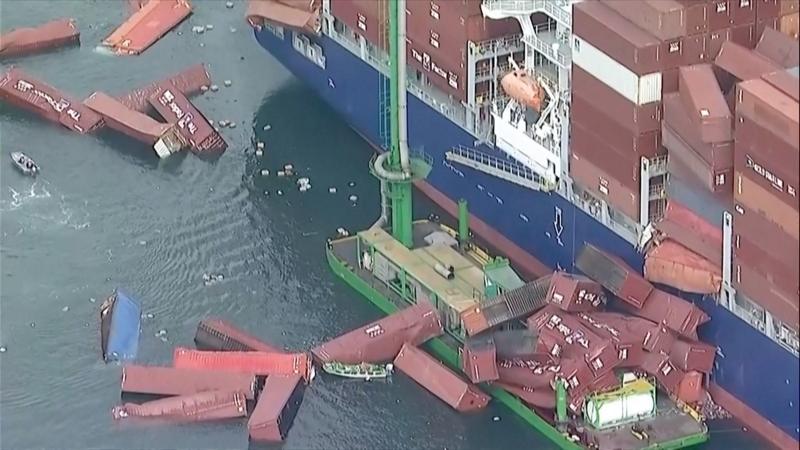 Aerial video shows toppled shipping containers floating in California harbour