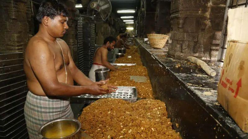 Men making laddus in the Tirupati temple kitchen