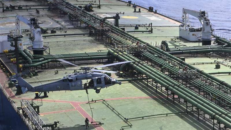 US boards ship carrying Iran oil as Trump threatens mine-laying vessels