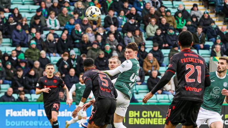 Owen Elding glances his header in