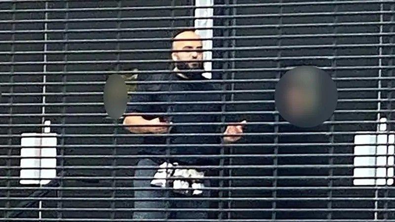 An image verified by the BBC, taken near the scene this morning, shows a man believed to be the suspect with items around his waist